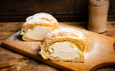 Vanilla cream roll pastry on a wooden table