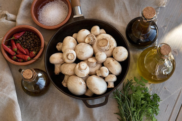 Champignon mushrooms in a cast iron skillet