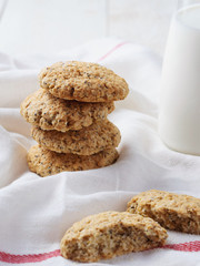  oatmeal cookies and milk on white background. Rustic style.