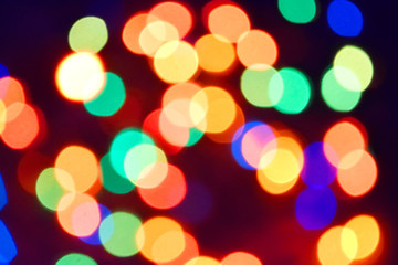 Street lamp with a light bulb and ice and snow at the top, attached to the wall