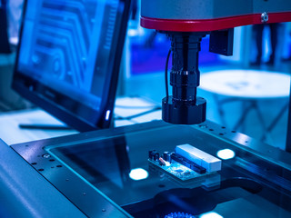 Chip manufacturing. Computer microscope examines the chip. The board lies under the microscope....