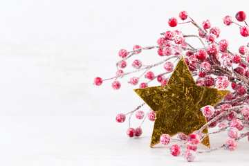 Christmas greeting card. Christmas tree branch on glitter golden bokeh lights background. New Year concept. Copy space.