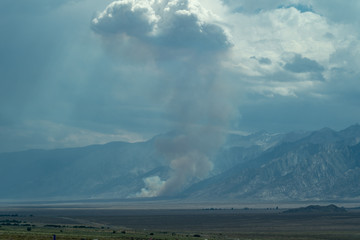 A wildfire caused by lightening starts in the Eastern Sierra Nevada Mountains off of US 395