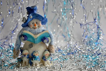 charming amusing snowman on shiny background close-up.