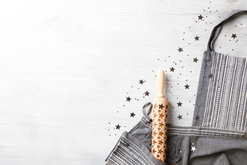 Kitchen apron on Holiday Background Concept of Christmas and New Year. Festive preparations  star decoration. Poster design, rolling Copy space for Text.