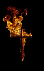 Burning cross on a black background