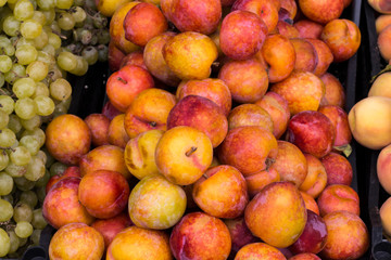 plums and grapes on the market