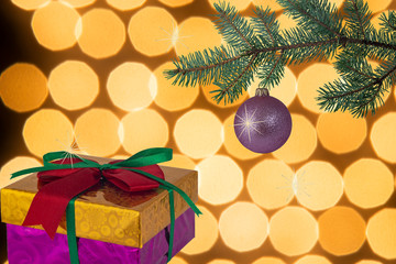 Sparkling Christmas ball gift box with green scarlet bow