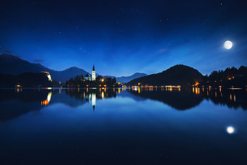 Lake Bled with St. Marys Church of the Assumption on the small island at night; Bled, Slovenia, Europe.
