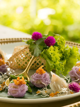 Thai ancient appetizer with green garden background.