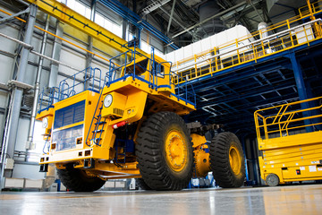 Big mining truck in the production shop of the car factory. Belaz is a Belarusian manufacturer of...