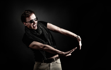 Handsome Young Guy Posing With a hat. Vintage Style Toned Picture