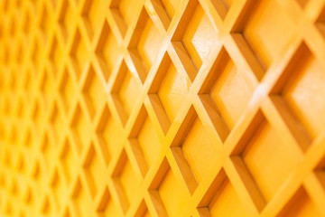 Texture of yellow wooden wall. Designed interior in the room