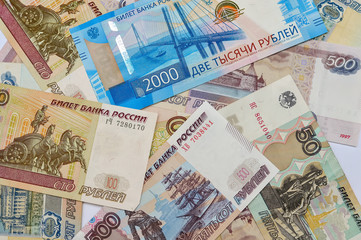 Money bills Russian currency 100 500 50 and 2000 rubles on the table, the country's economy, loan payment bonus loan