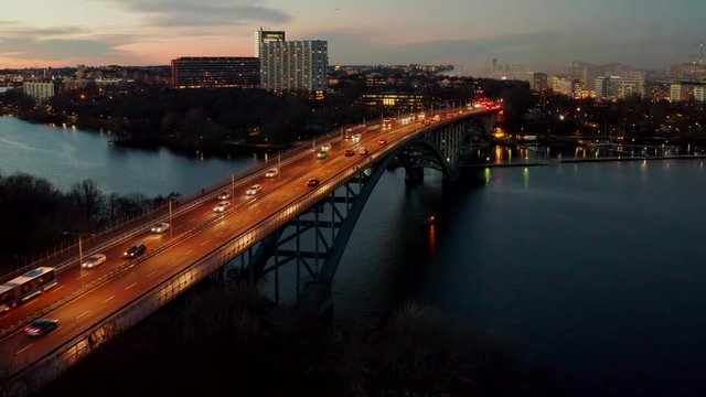 Aerial footage of bridge Vasterbron in Stockholm at dusk 