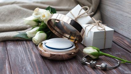 Modern anti age luxury cosmetics. Beautiful round plastic box with crystals - Cushion. The best holiday gift for a woman. Cosmetology. Flat lay. Healthy skin. Birthday and women's day gift, present.