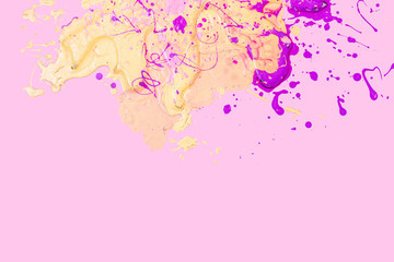Yellow and pink blots on pink background. Texture of paint