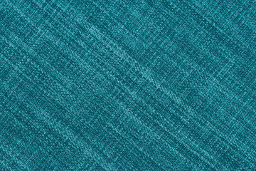 Close up of a woolen fabric of turquoise color.