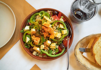 Farm salad with fresh vegetables and cheese.