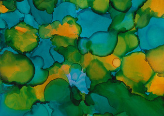 Colorful alcohol ink texture with abstract washes and paint stains on the white paper background.
