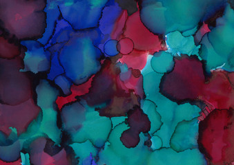 Colorful alcohol ink texture with abstract washes and paint stains on the white paper background.