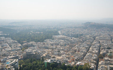 Fototapeta premium Aerial view on rooftops and houses in Athens, Greece.