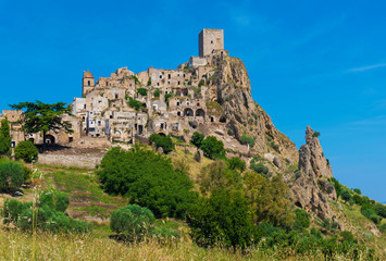 Fototapeta na wymiar Craco (Italy) - The evocative ruins and landscapes of the ghost town scattered among the badlands hills of the Basilicata region, beside Matera, destroyed by a landslide and abandoned.
