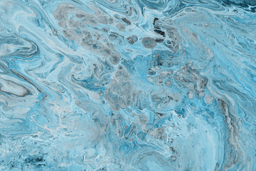 Acrylic abstract background with waves and strokes on white paper background. Trendy look. Chaotic abstract organic design.