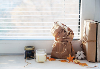 Warm and cosy  concept with candles on a windowsill
