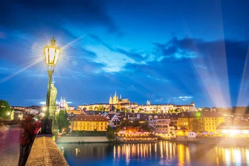 Deurstickers The beautiful landscape of the old town and the Hradcany (Prague Castle) with St. Vitus Cathedral and St. George church in Prague, Czech Republic at night. amazing places. popular tourist atraction © anko_ter