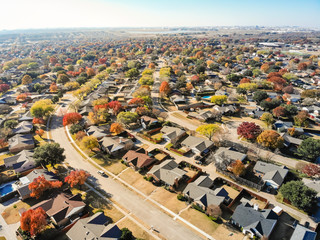 Aerial view beautiful neighborhood in Coppell, Texas, USA in autumn season. Row of single-family...