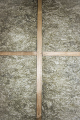 Insulation of attic with fiberglass cold barrier and insulation material