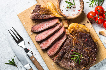 Grilled beef steak ribeye on white. 