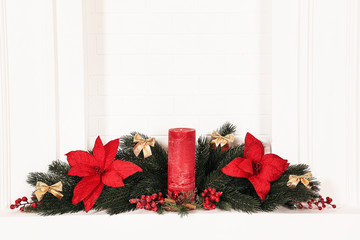 Christmas decorations with fireplace on brick wall background