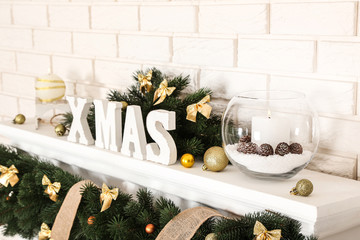 Christmas decorations with fireplace on brick wall background