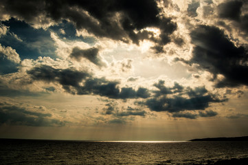 sun shining through the clouds