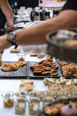 garden receptions - table with a white tablecloth, with various kinds of sweets, cakes and snacks