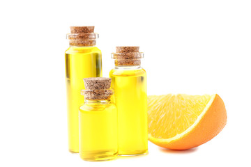 Orange oil in bottles isolated on white background