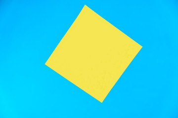 Yellow paper sticker on a blue background