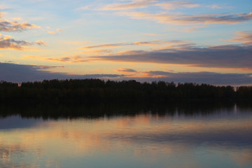 Fototapeta na wymiar Misty morning sunrise reflection in a lake.
