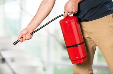 Hand presses the trigger fire extinguisher hand presses the