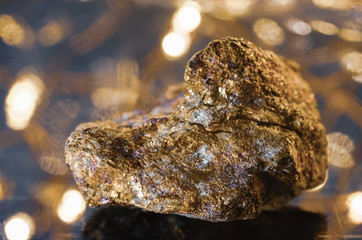 Stone pyrite on a glowing background