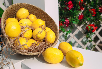 Wicker basket with lemons.