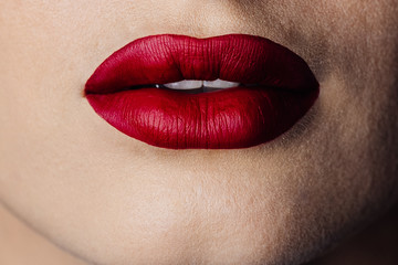bright red lips with matte lipstick. close-up