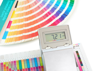 Printed color swatch with density meter and paint guide isolated on white background. Color density...