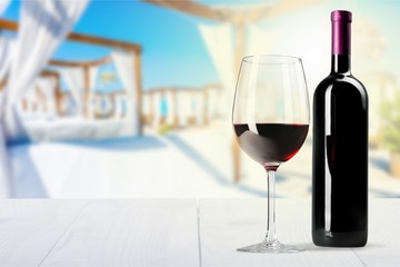 Red Wine in Bottle and Glass on white background