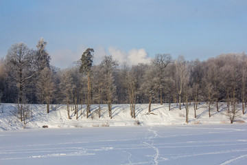 Winter landscape in clear weather. Frosty daylight at sunset