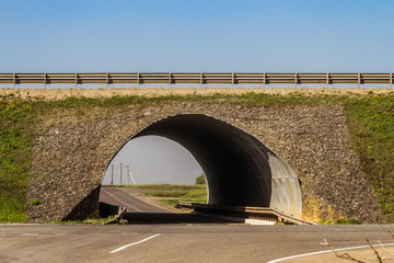 Countryside asphalt two-level road with a tunnel crossed. Lipetsk region, Russia.