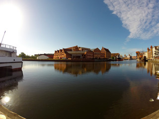 Gdansk at the sunrise. Motlawa river, Polish Baltic Philharmonic.