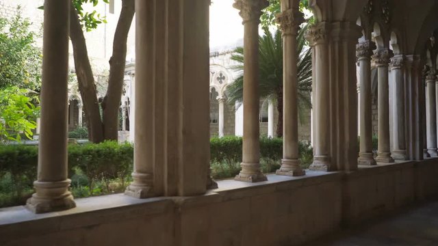 Cloister with beautiful arches and columns in old Dominican monastery in Dubrovnik
